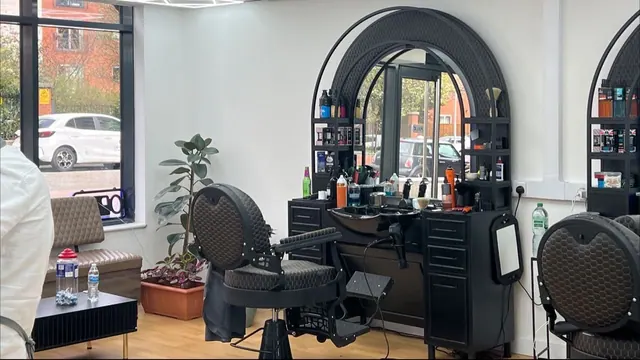 Inside: arched mirror stations and a barber chair
